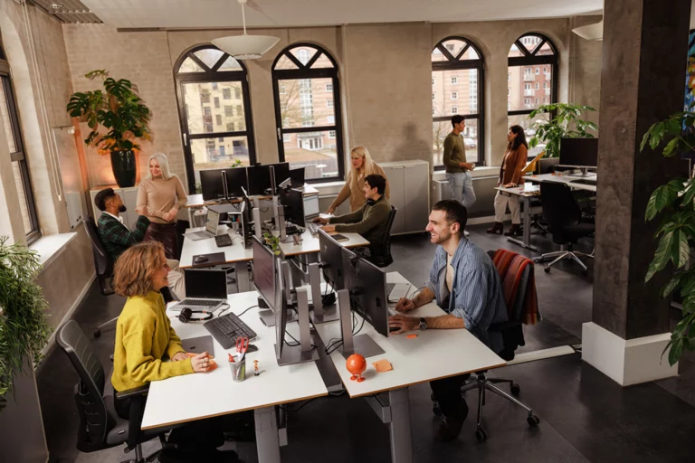 multilingual-team-open-plan-office-working-togetherwebp